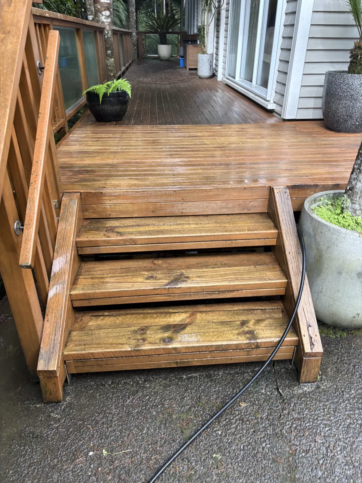 Cleaned timber deck steps and treads leading up to a deck